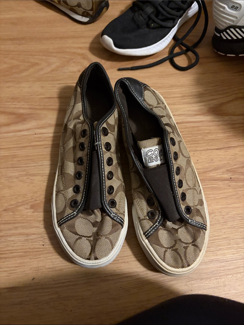 Coach Women’s Signature Canvas Slip-On Sneakers in Khaki and Black